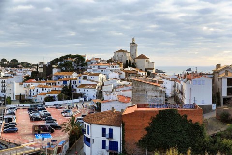 Local view, former fishing village of Cadaques with landmark, white church of Santa Maria,
