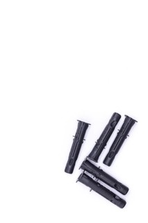 Black plastic dowels on white background, top view