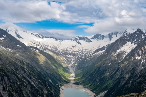 Mountain landscape, view of turquoise-blue lake Schlegeisspeicher, glaciated rocky mountain peaks