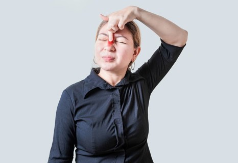Young woman with pain touching nose. People with nasal bridge pain, Girl with nasal bridge headache