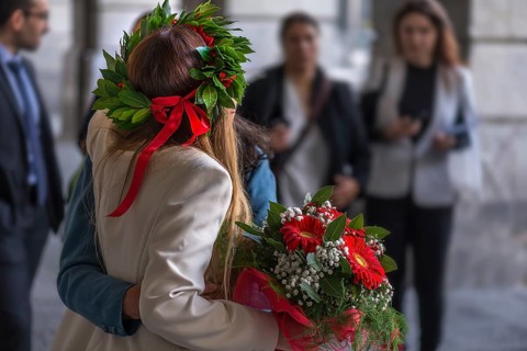 Graduate of the University of Genoa with traditional laurel wreath and red ribbon and bouquet of