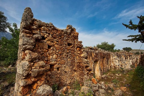 Stone ruins surrounded by trees and a cloudy sky, Aradena Gorge, Aradena, Sfakia, Crete, Greece,