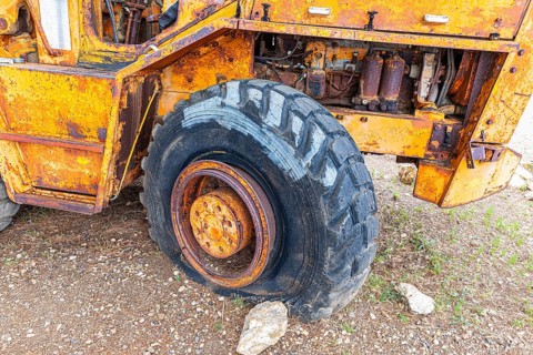 Rusted bulldozer wreck in the former Miniere Calamita mine, Elba, Tuscan Archipelago, Tuscany,