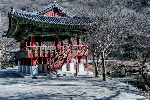 Oriental pavilion at Buddhist temple on late autumn morning