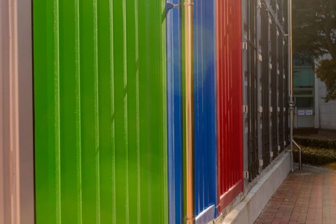 Exterior wall of building built to resemble metal shipping containers