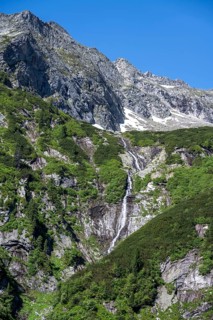 Kesselbach waterfall, rocky mountain peaks, Berliner Hoehenweg, Zillertal Alps, Tyrol, Austria,