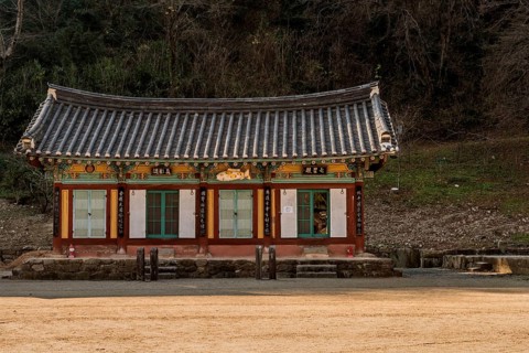 Prayer hall at Buddhist temple on sunny autumn morning