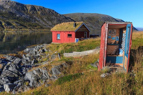 Rorbuer with toilet (outhouse) on the fjord off Bergen, summer, Nordkinn Peninsula, Finnmark,