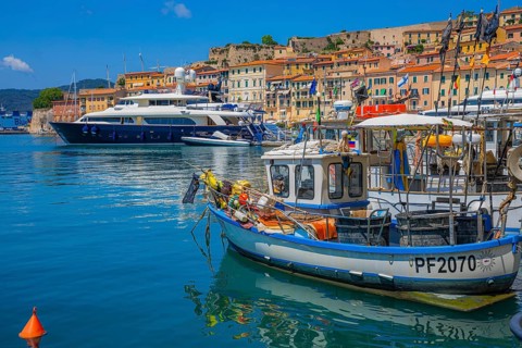Fishing boats and luxury yachts in the harbour of Portoferraio, Elba, Tuscan Archipelago, Tuscany,