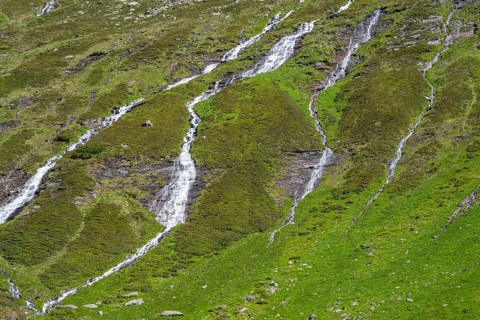 Waterfalls on a green mountainside, Berliner Hoehenweg, Zillertal Alps, Tyrol, Austria, Europe