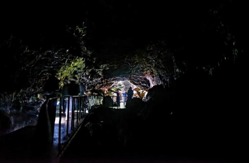 People walking to the cave exit in the lava tunnel Gruta das Torres, Gruta das Torres, Pico, Sao