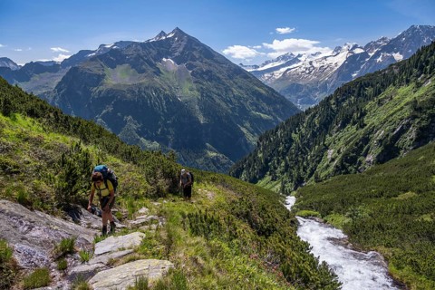 Two mountaineers on a hiking trail by a stream, Berliner Hoehenweg, summit Grosser Ingent and