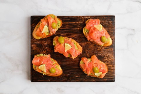 Top view of sandwiches with salted salmon and avocado