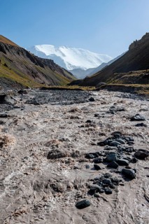 Valley with river Achik Tash between high mountains, mountain landscape with peak Pik Lenin, Osh