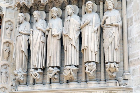 Figures of saints, detail on the Gothic entrance portal of Notre Dame de Paris Cathedral, Paris,