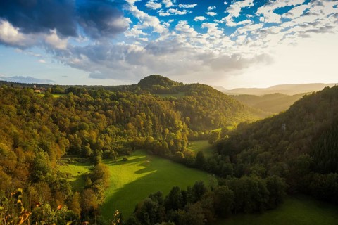 River with gorge and autumnal coloured forest, valley of the Loue, Lizine, near Besancon,