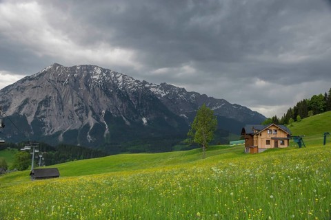 Summer austrian landscape with Grimming mountain (2.351 m), an isolated peak in the Dachstein