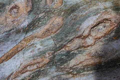 Coloured, ferrous mineral rocks on the beach of Topinetti, near Rio Marina, Elba, Tuscan