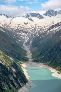 Mountain landscape, view of turquoise-blue lake Schlegeisspeicher, glaciated rocky mountain peaks
