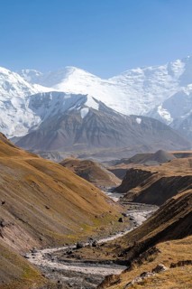 Valley with river Achik Tash between high mountains, mountain landscape with peak Pik Lenin, Osh