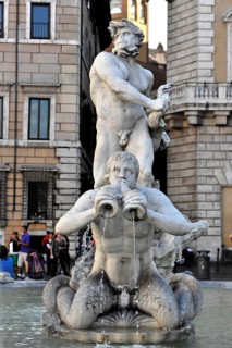 Fountain figure of a Triton, Moor Fountain or Fontana del Moro, Piazza Navona, Rome, Lazio, Italy,