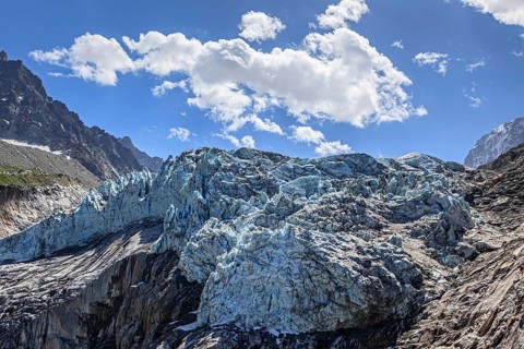 Glacier tongue at midday light in front of mountains, backlight, D'Argentiere glacier, Mont Blanc