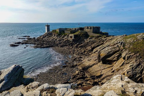 Peninsula Kermorvan with lighthouse and fort, behind the island Ouessant, Le Conquet, department