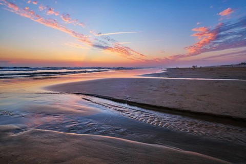 Atlantic ocean after sunset with surging waves at Fonte da Telha beach, Costa da Caparica,