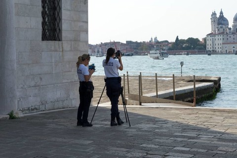 Police laser speed measurement on the island of San Giorgio Maggiore, on the waterfront of the