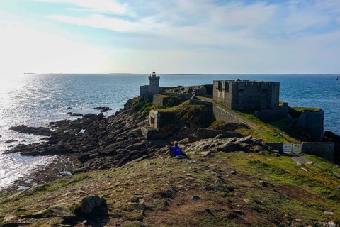 Peninsula Kermorvan with lighthouse and fort, behind the island Ouessant, Le Conquet, department