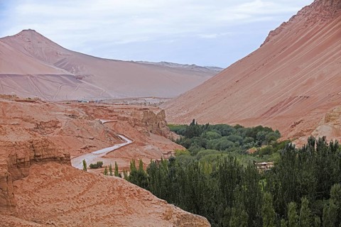 Road winding through the Flaming Mountains, Gaochang Mountains in the Tian Shan of Xinjiang near