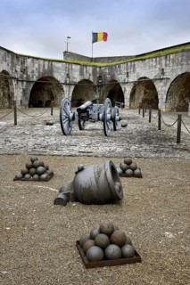 Cannon, mortar and cannonballs at inner court in the citadel at Dinant, Belgium, Europe