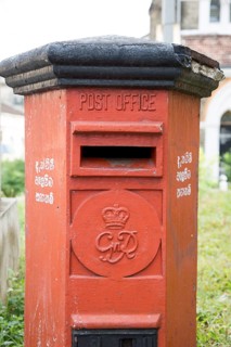 Old red British Post Office pillar box in the historic town of Galle, Sri Lanka, Asia