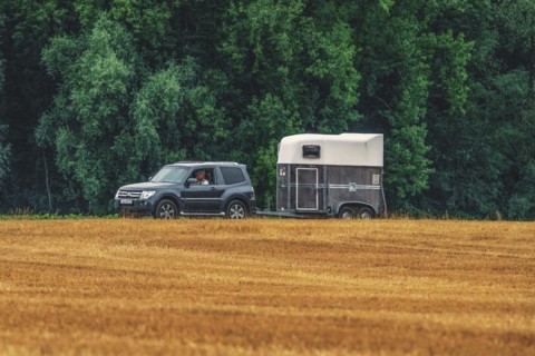 Off-road vehicle with horse trailer on an agricultural field, Osterholz, Wuppertal, North
