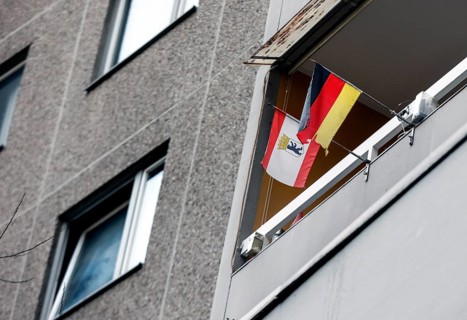 A tenant in the Gropiushaus has decorated his balcony with a German flag and the flag of Berlin.