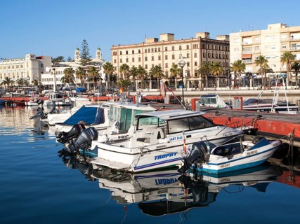 Boats in harbour and town centre buildings, Melilla. Spanish territory in north Africa, Spain,