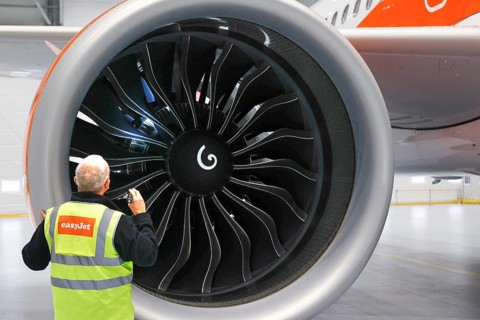 Olaf Gross, Licence Engineer at easyJet, checks the engine of an Airbus A320 Neo in front of the