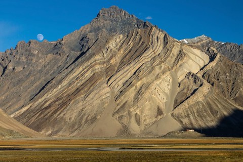 Impressive cliff in the Zanskar Mountains of the Himalayas, with clearly visible folded strata, the