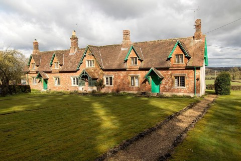 Traditional row of rural cottages in small terrace, Compton Bassett, Wiltshire, England, UK