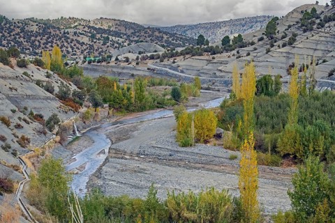 Stream and desolate dwelling in the High Atlas Mountains, Midelt Province, Draa-Tafilalet Region,