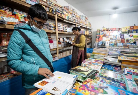 Book readers browsing books at a stall during Assam Book Fair, in Guwahati, Assam, India on 29