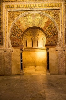 Richly inscribed stonework of keyhole shaped Mihrab, the centrepiece of the Great Mosque, Cordoba,