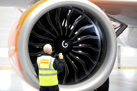Olaf Gross, Licence Engineer at easyJet, checks the engine of an Airbus A320 Neo in front of the