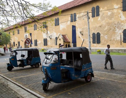 Motor rickshaw known as tuk-tuks inside the fort area of historic town of Galle, Sri Lanka, Asia