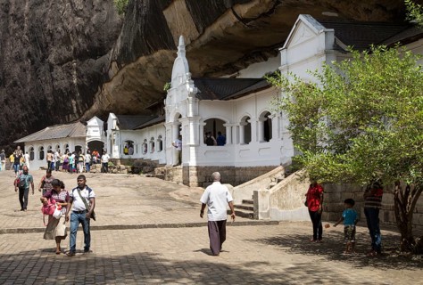 People at Dambulla cave Buddhist temple complex, Sri Lanka, Asia
