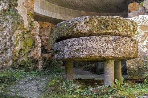 Old millstones in the Trou des Fees at the village Chassepierre near Florenville in the province of