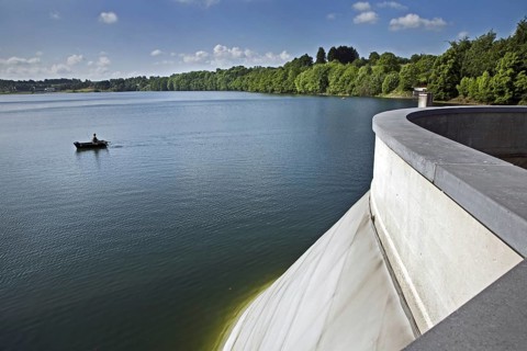 Angler in rowboat on the Buetgenbach reservoir in the Hautes Fagnes, High Fens, Ardennes, Belgium,