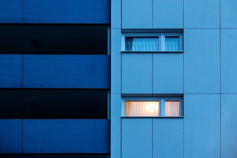 Illuminated room in a tower block in Gropiusstadt. The rise in rents in German cities has increased
