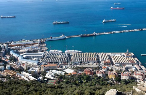 View over docks and shipyard warehouses in Gibraltar, British territory in southern Europe