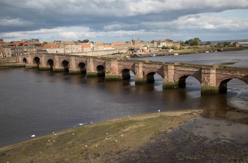 Historic stone bridge crossing River Tweed, Berwick-upon-Tweed, Northumberland, England, UK